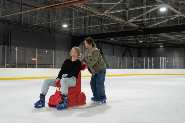 Skater using a skate aid on the ice
