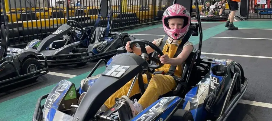 Young driver in a pink helmet