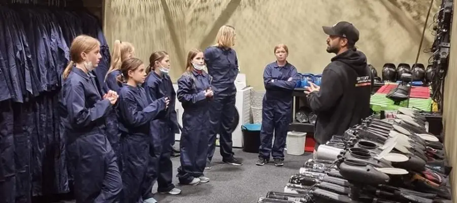 Group in overalls at the safety briefing